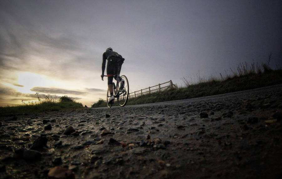 Bike Lover On A Sunrise Wallpaper