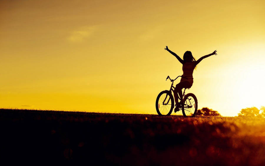 Bike Lover's Silhouette On A Sunset Wallpaper