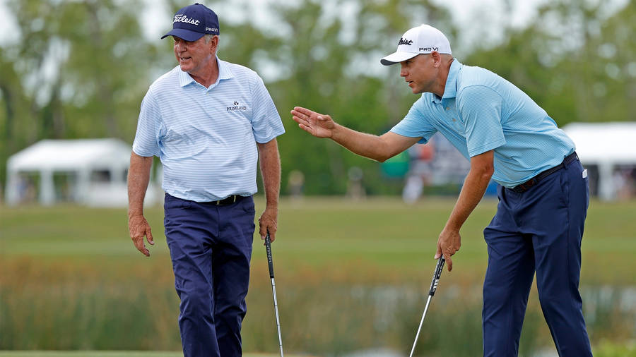 Bill Haas Alongside His Father, Jay Haas, In A Warm And Memorable Moment Wallpaper