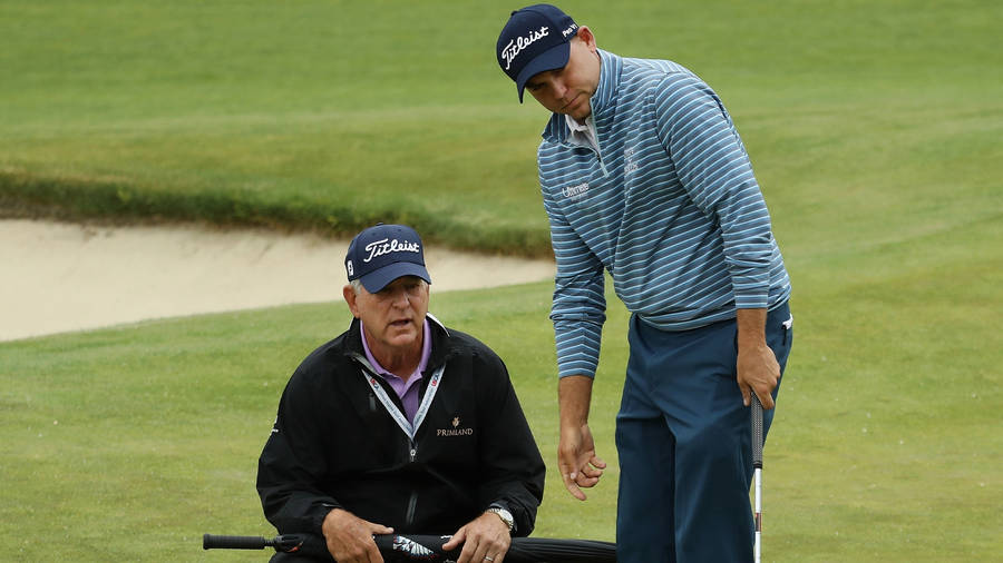 Bill Haas And His Father, Jay Haas, Sharing A Moment On The Golf Course Wallpaper