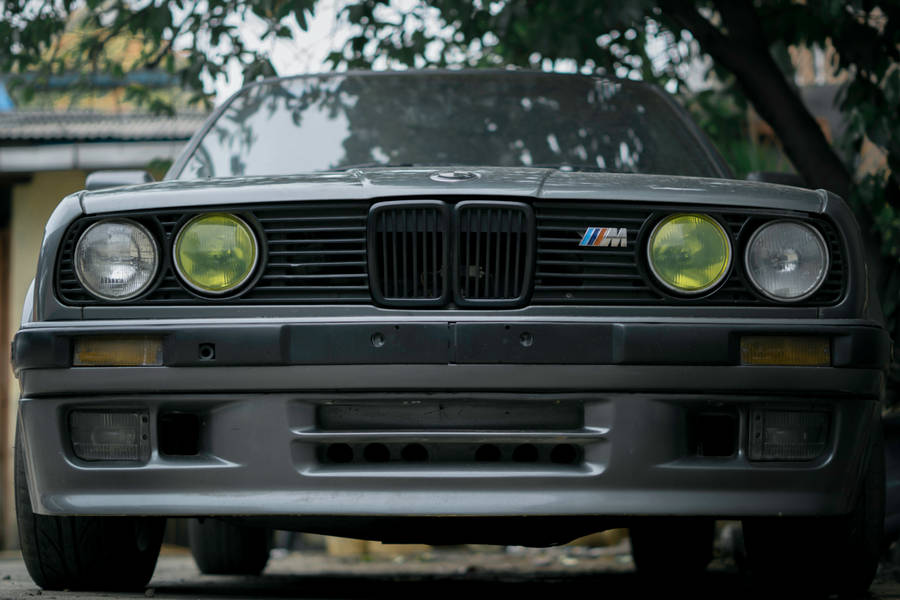 Black Bmw M Near A Tree Close-up Wallpaper