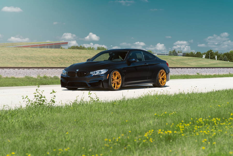 Black Bmw M4 Gold Wheels Wallpaper