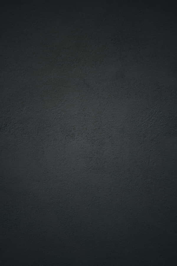 Black Concrete Wall Background With A Light Reflection Wallpaper