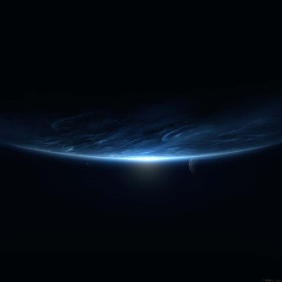 Black Ipad With Blue Planet In Outer Space Wallpaper