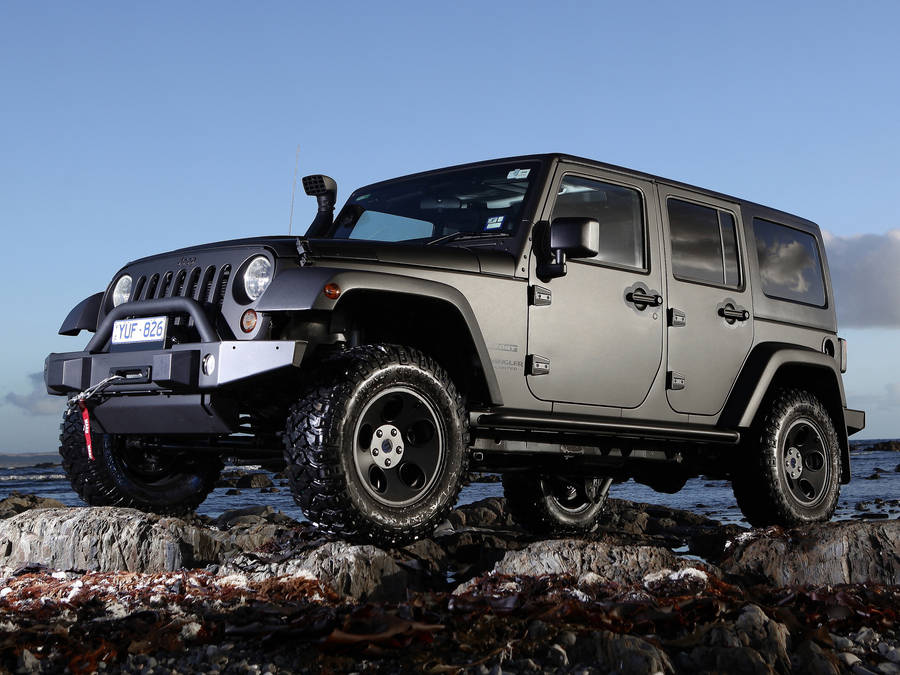 Black Jeep On Rock Wallpaper