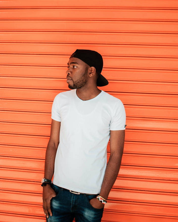 Black Man Against An Orange Backdrop Wallpaper