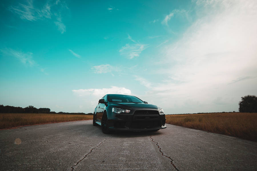 Black Mitsubishi Lancer Clear Sky Wallpaper