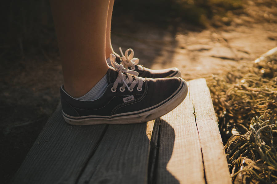 Black Vans On Wood Plank Wallpaper