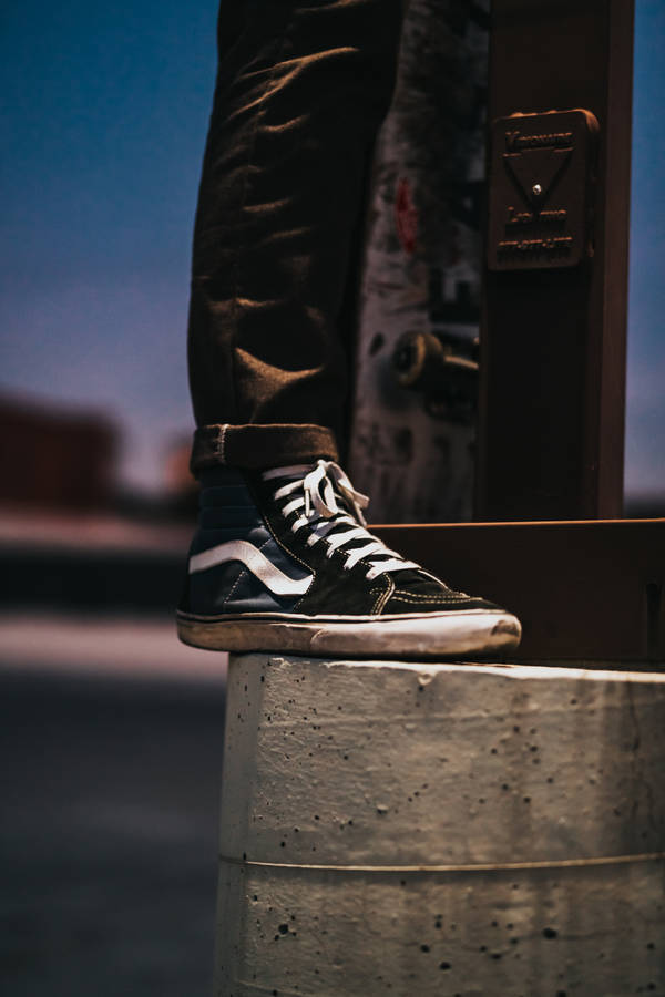 Black Vans Sk8-hi On Concrete Wallpaper