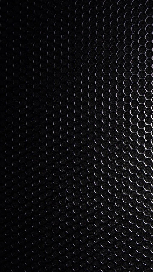 Blank Black Steel Plate With Holes Wallpaper