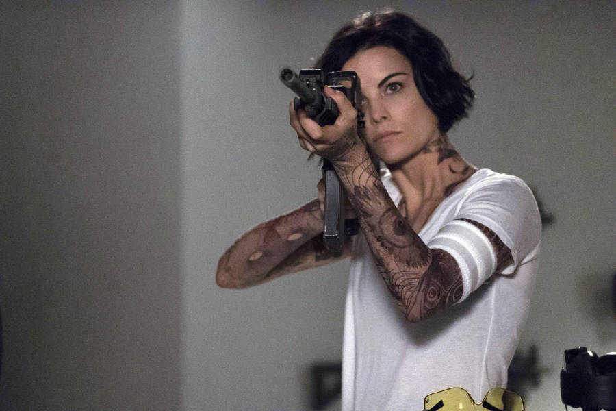 Blindspot Character Jane Doe Aiming A Rifle Wallpaper