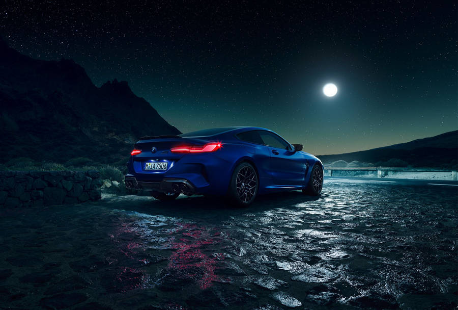 Blue Bmw And A Starry Night Sky Wallpaper