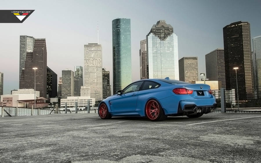 Blue Bmw M4 Gtrs4 Skyscrapers Wallpaper