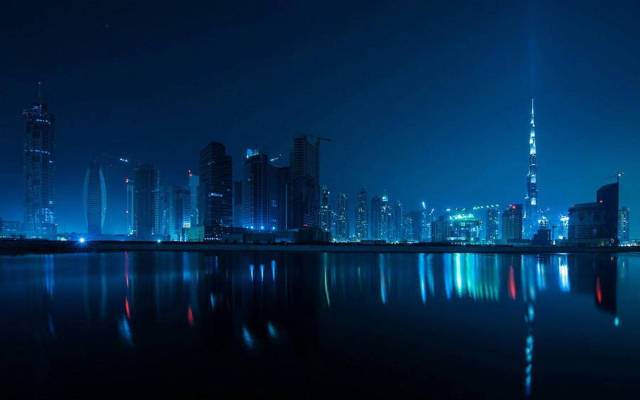 Blue Lit Dubai Skyline Buildings Wallpaper