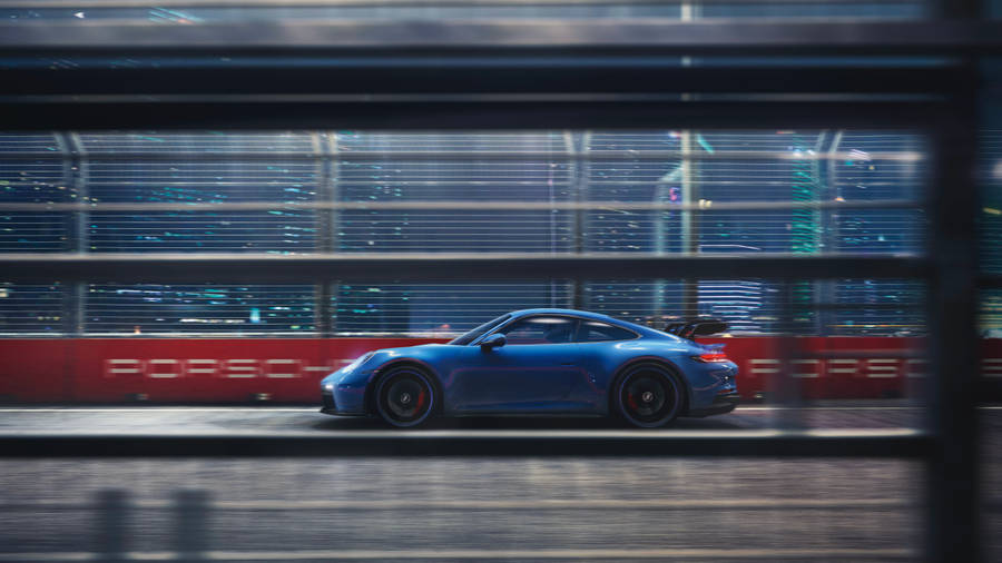 Blue Porsche 911 Outside The Window Wallpaper