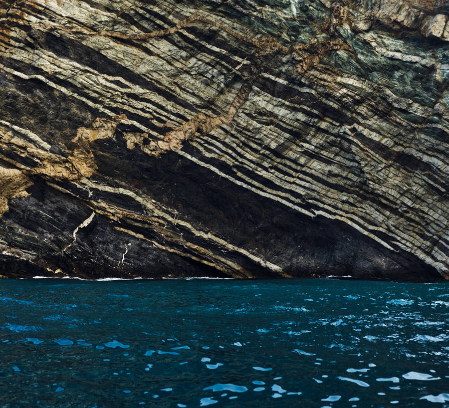 Blue Water Huge Rocks Macos Wallpaper