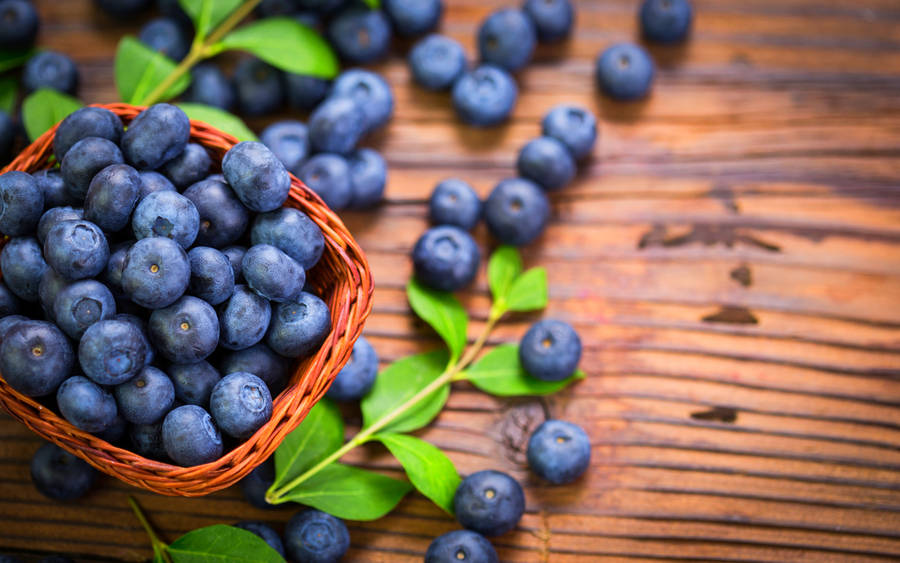 Blueberries On A Wood Table With Nice Grain Wallpaper