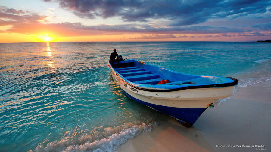 Boat On Turquoise Water Wallpaper