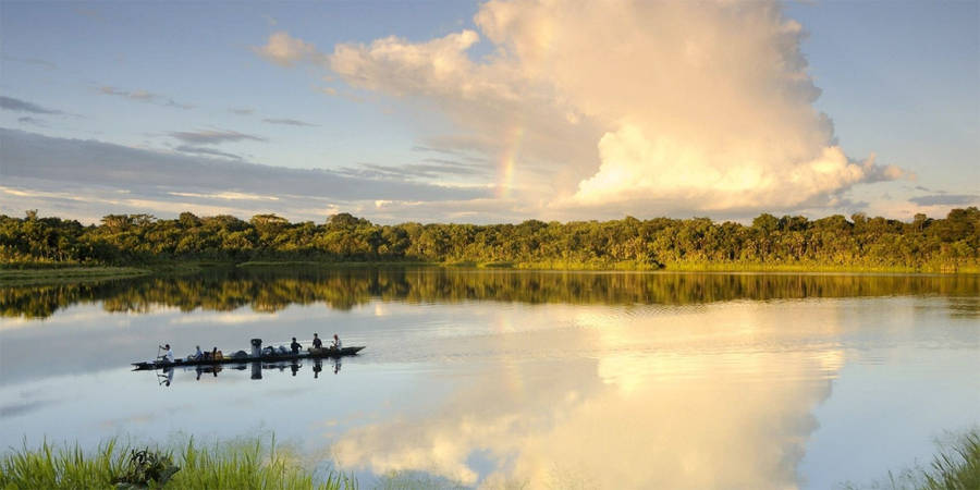 Boat Sailing On Amazonas Waters Wallpaper