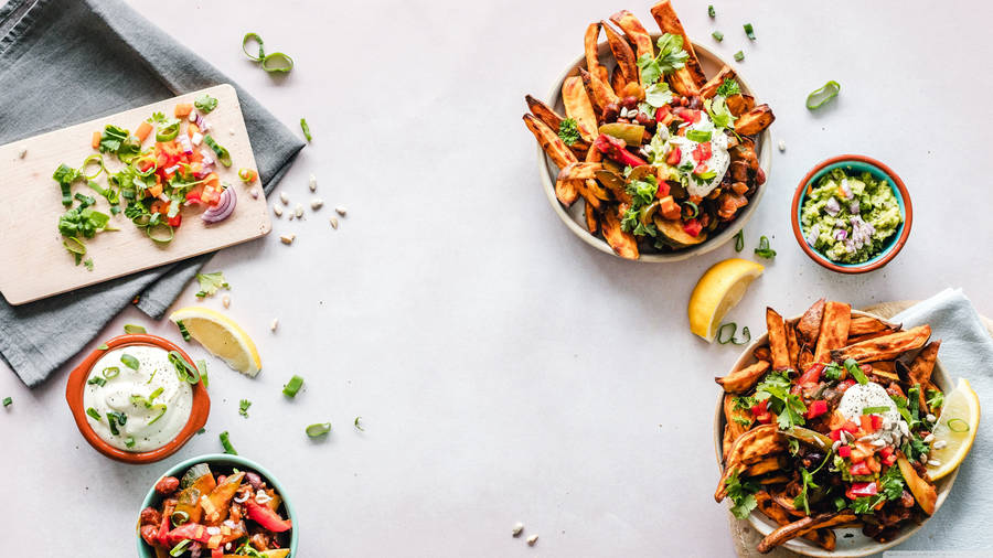 Bowls Of Finger Foods In White Table Wallpaper