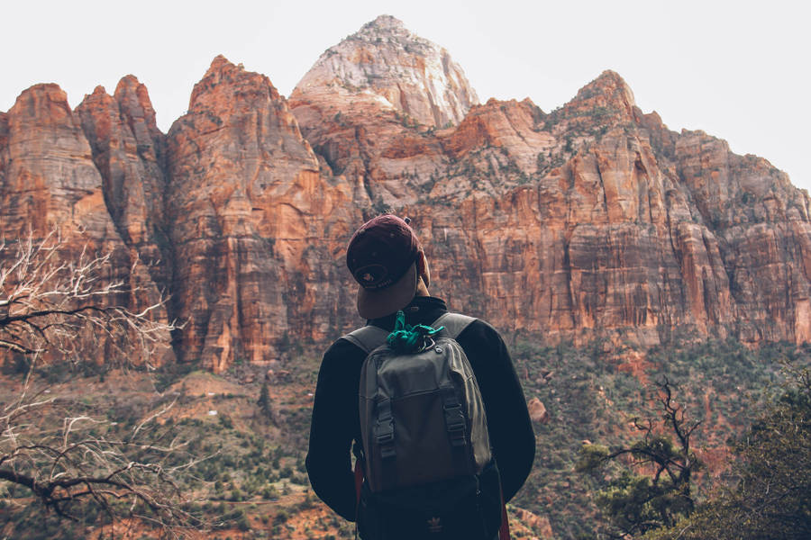 Boy In Brown Stone Mountain Wallpaper