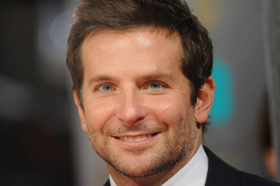 Bradley Cooper Smiling Back At Camera Wallpaper