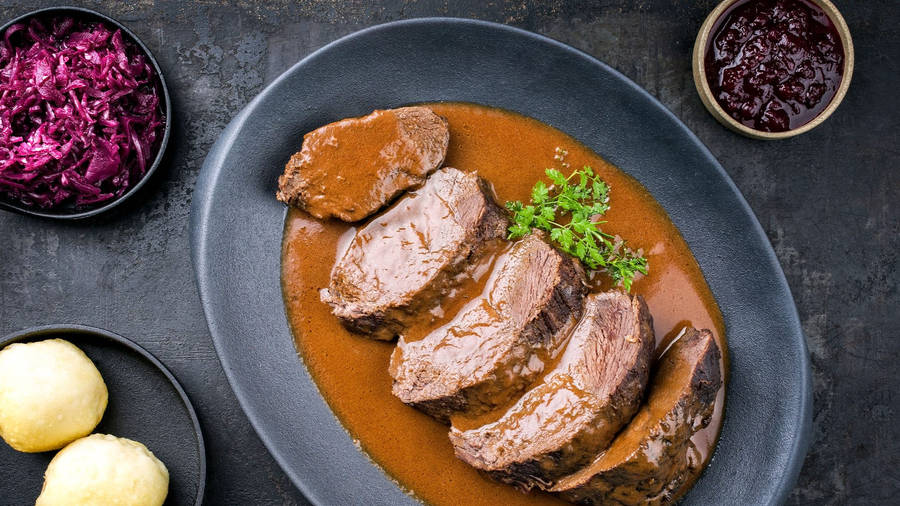 Braised Sauerbraten Traditional German Dish With Creamy Sauce Wallpaper