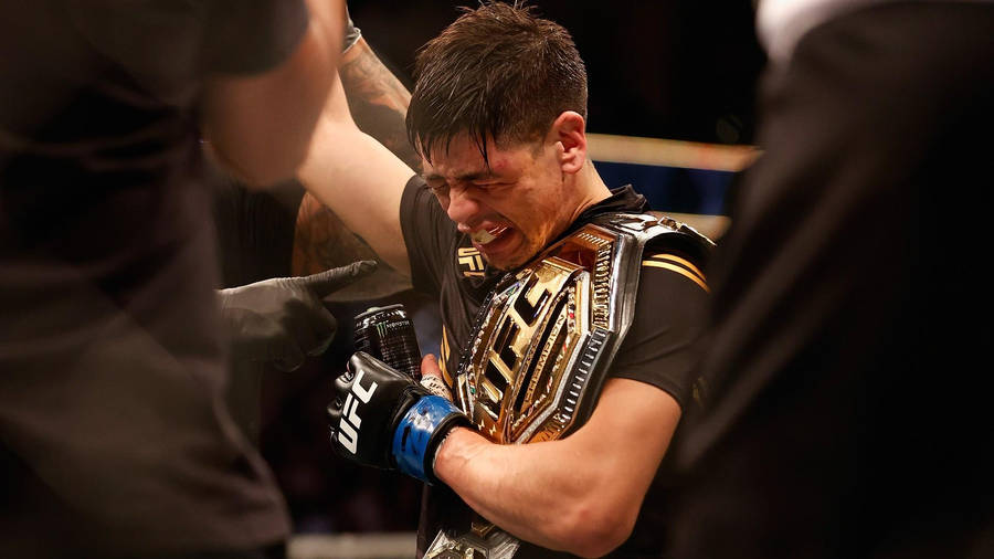 Brandon Moreno Crying Holding Belt Wallpaper