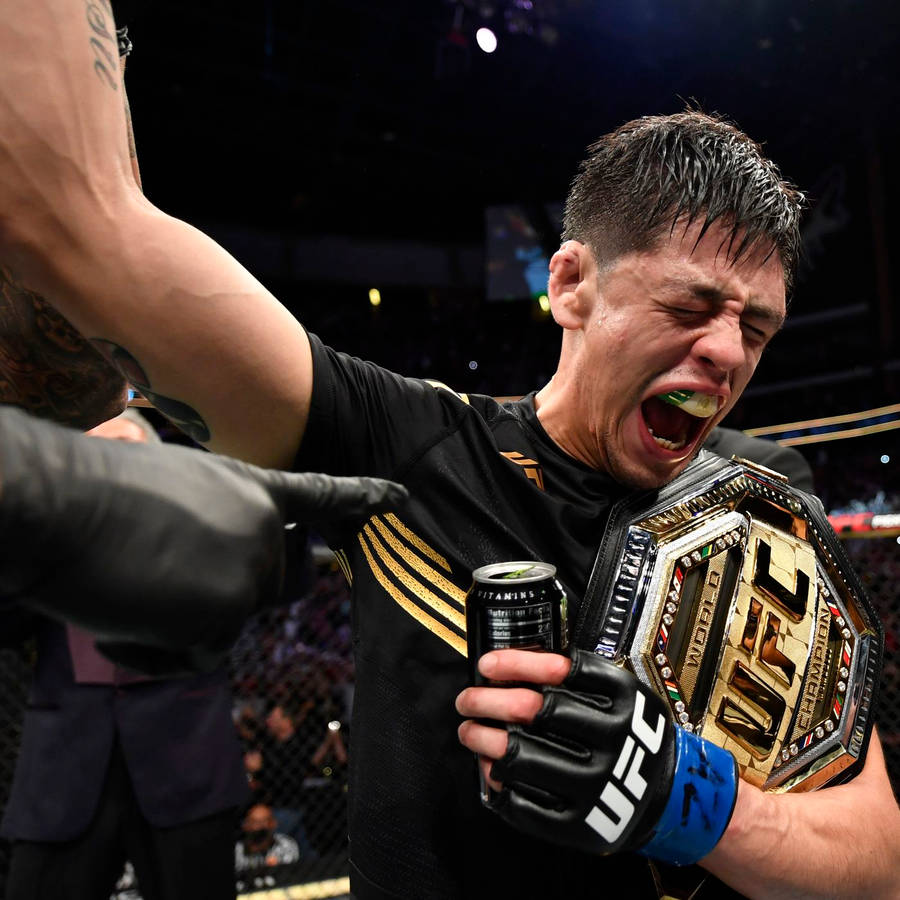 Brandon Moreno Screaming Holding Belt Wallpaper