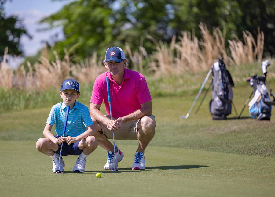 Brandt Snedeker And Son Playing Golf Wallpaper