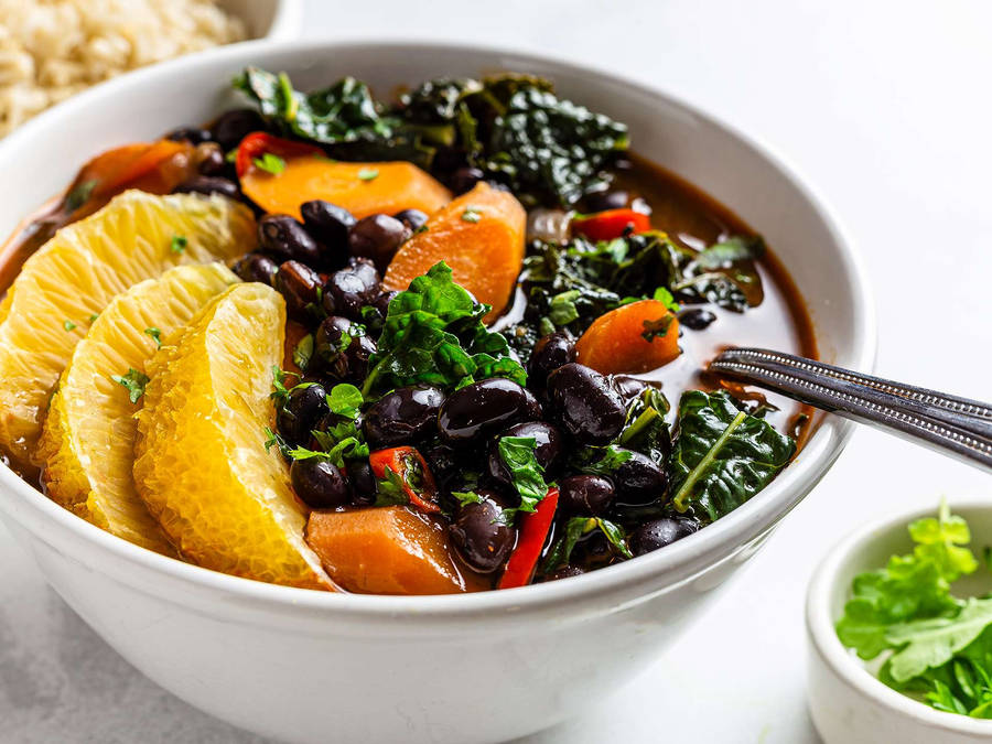 Brazilian Black Bean Stew Feijoada In Beautiful Plating Wallpaper