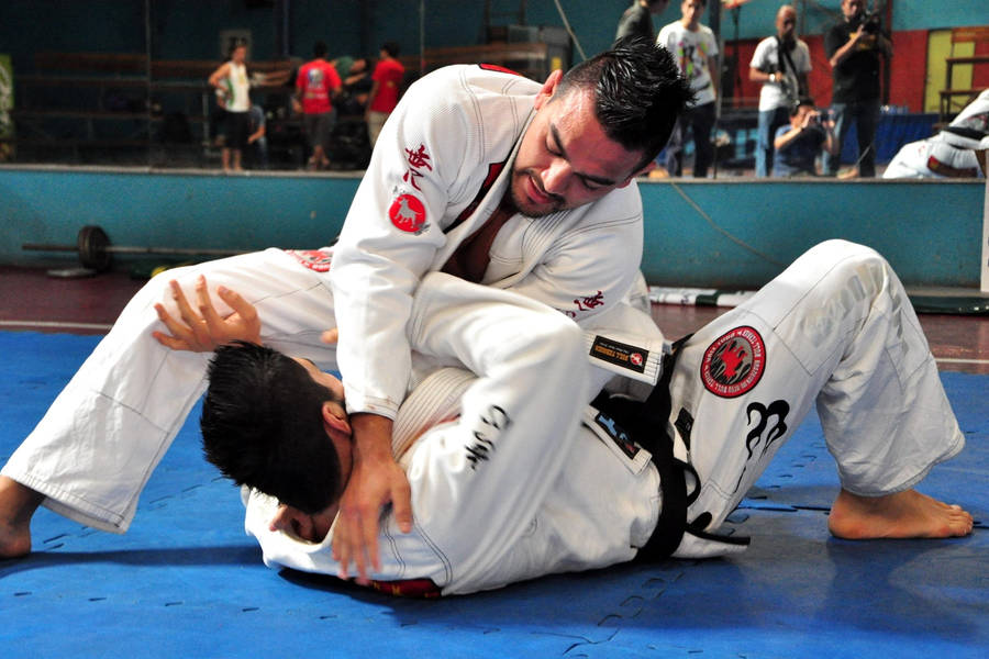 Brazilian Jiu-jitsu Masters Marcos And Roberto De Souza In Action Wallpaper