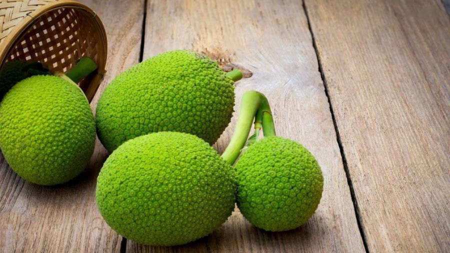 Breadfruit On Wooden Table Wallpaper