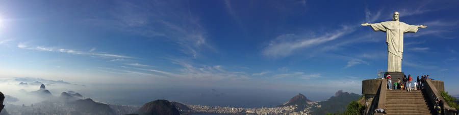 Breathtaking Sunset Over Christ The Redeemer In Rio De Janeiro Wallpaper