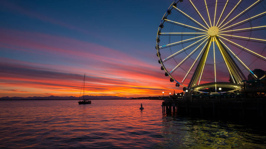 Breathtaking Sunset View Of The Washington Great Wheel Wallpaper