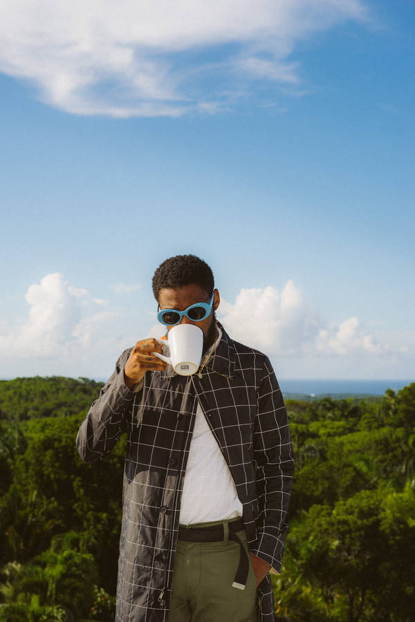 Brent Faiyaz Drinking From Mug Wallpaper