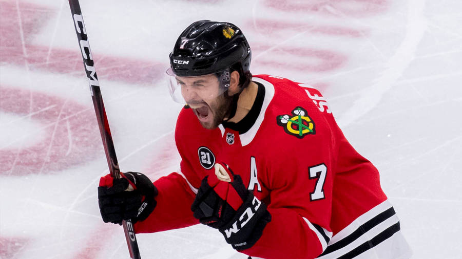 Brent Seabrook In Action On The Ice Rink Wallpaper