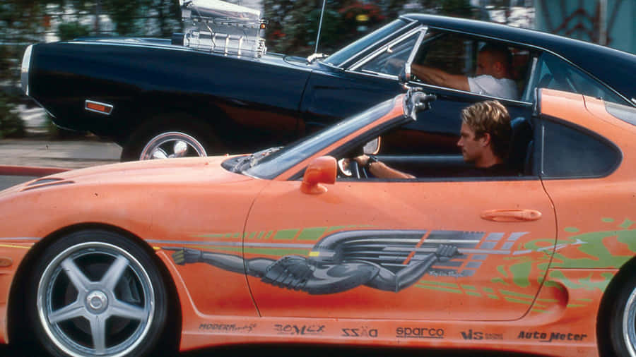 Brian Driving Car In Fast And Furious 1 Wallpaper