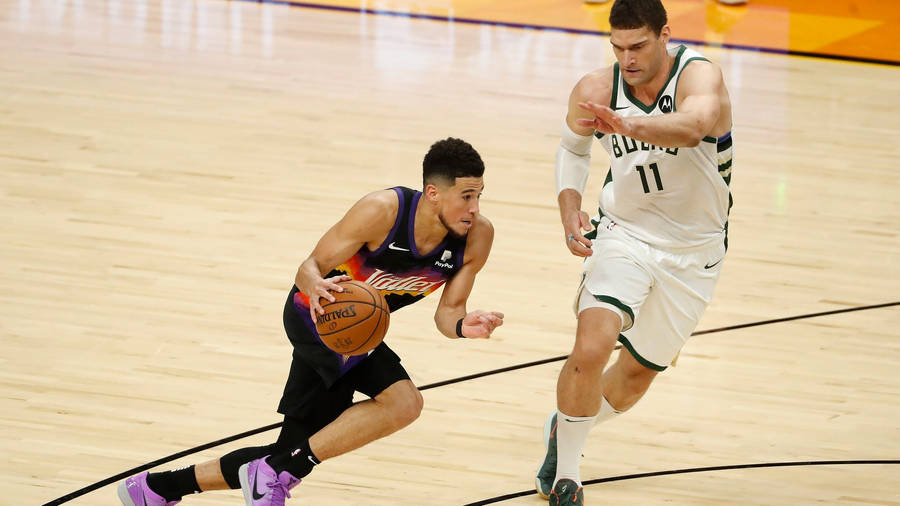 Brook Lopez Against Devin Booker Wallpaper