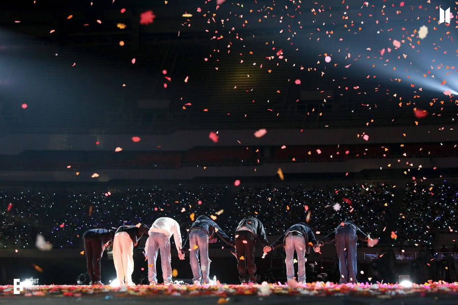 Bts Concert With Members Bowing To Army Wallpaper