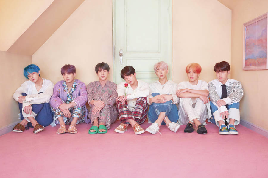 Bts Desktop Seated In Front Of Door Wallpaper