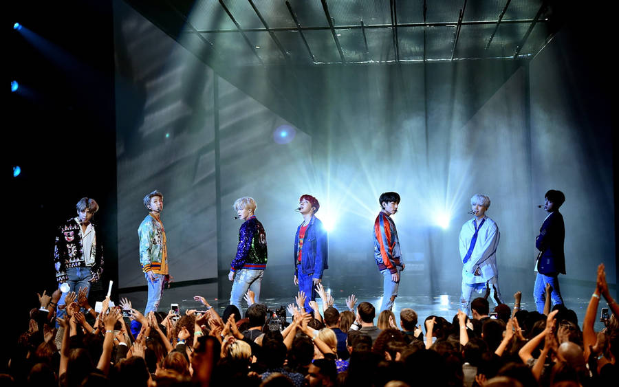 Bts Group Photo On Stage Wallpaper