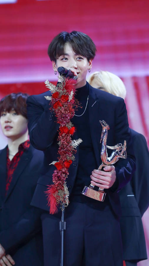 Bts Jung Kook Receiving Award Wallpaper