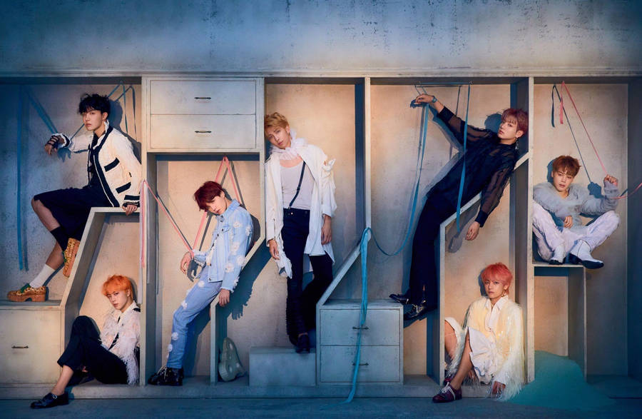 Bts Members Posing In Cabinet Shelves Laptop Wallpaper