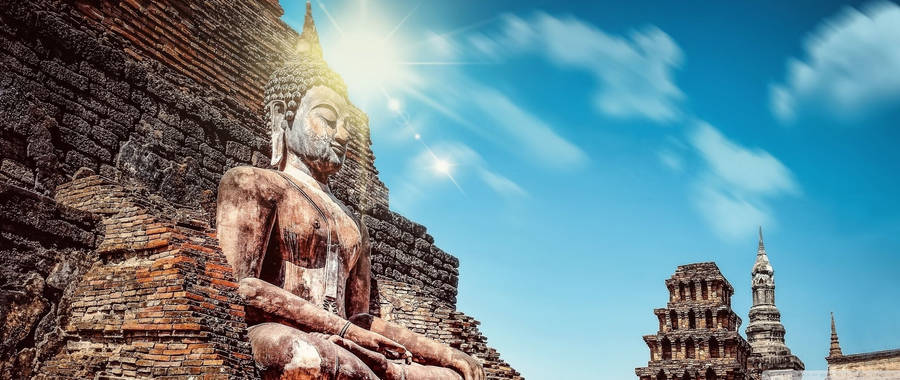 Buddha Statue Under Sun Wallpaper