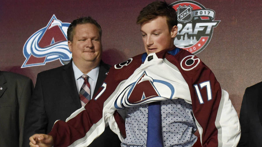 Cale Makar In Action Wearing Colorado Avalanche Jersey Wallpaper