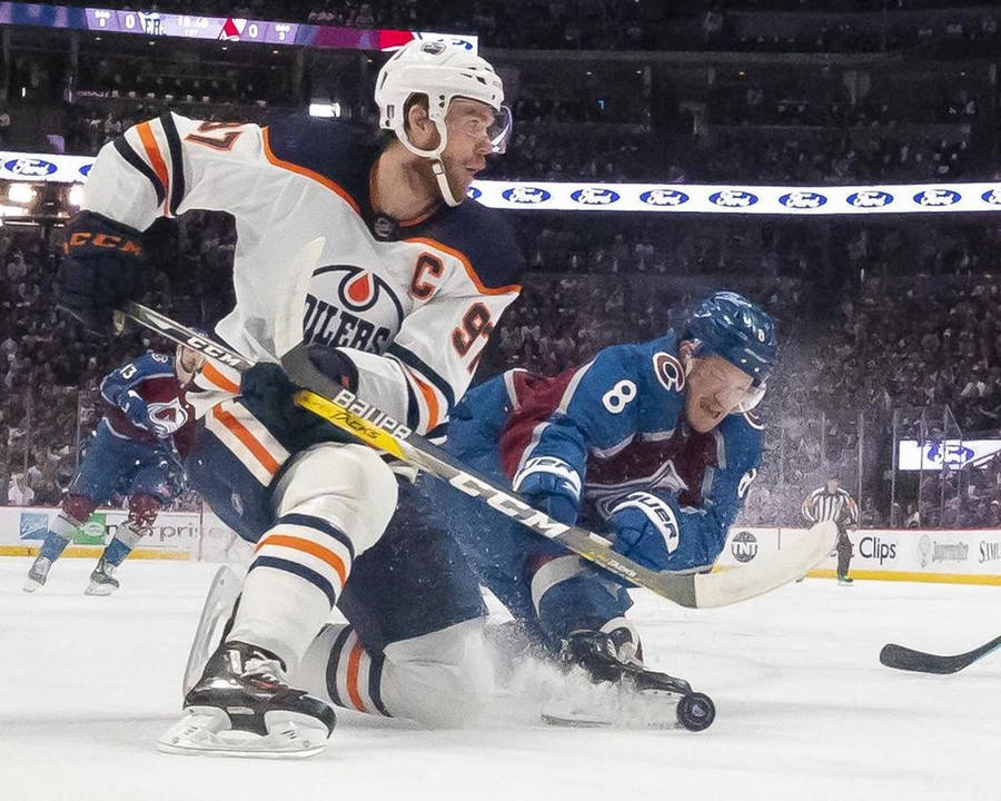 Cale Makar Tackles Connor Andrew Mcdavid Wallpaper