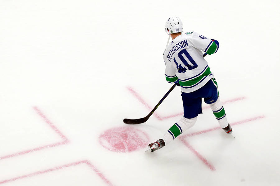 Canadian Nhl Player Elias Pettersson Top View Shot Wallpaper