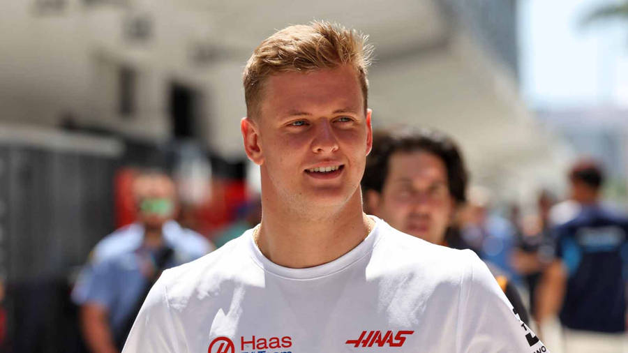 Candid Mick Schumacher White Shirt Wallpaper