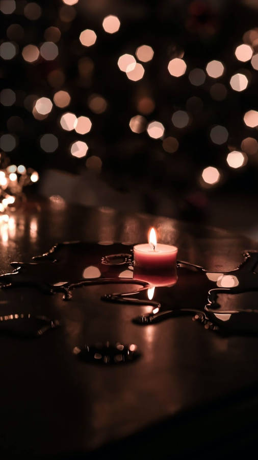 Candles On Table With Water Wallpaper